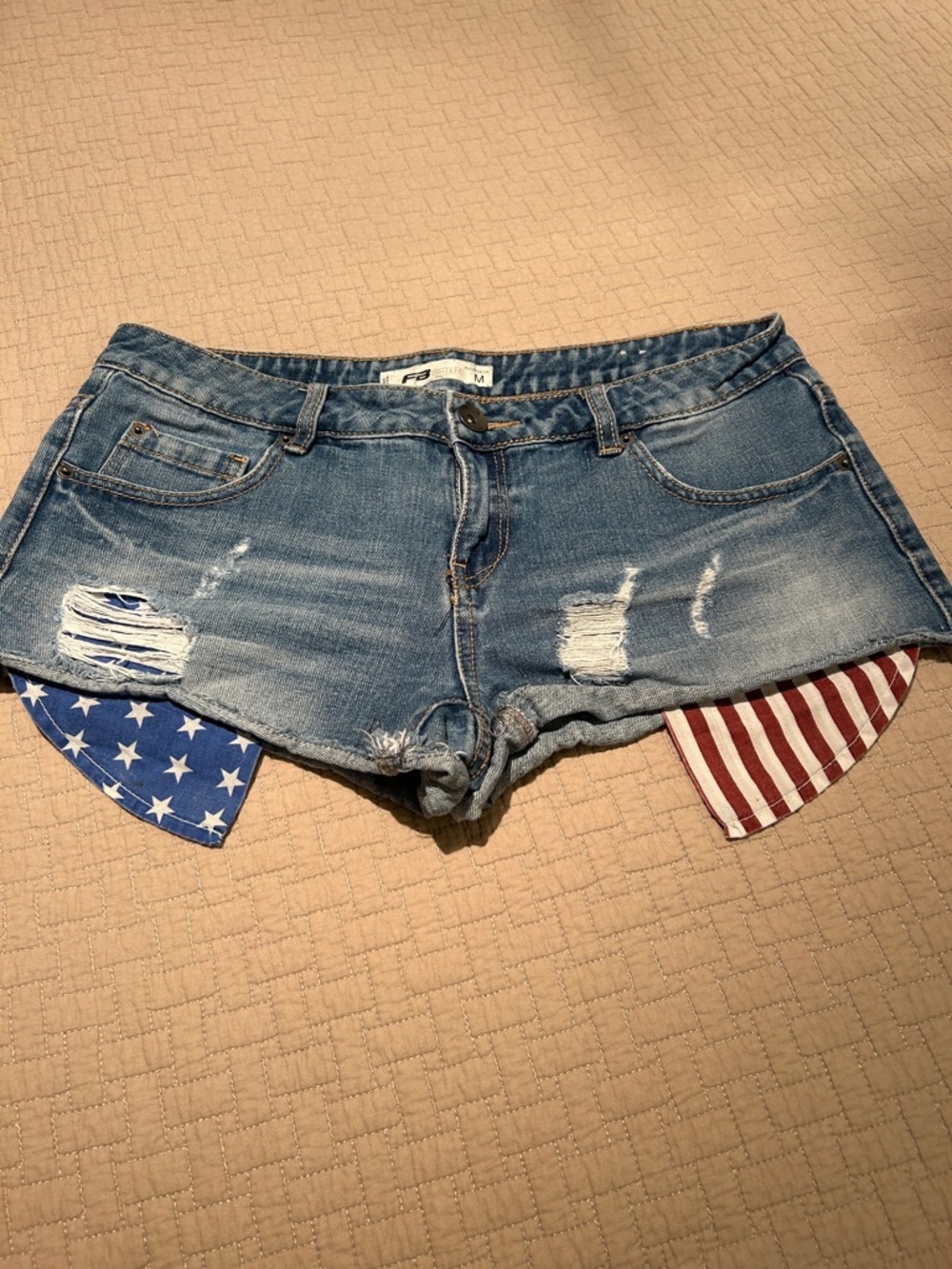 Women's Distressed Blue Denim Shorts with Flag Pocket Detail